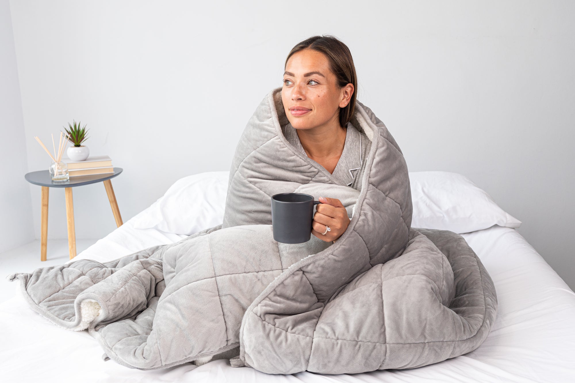 woman in bed with tea