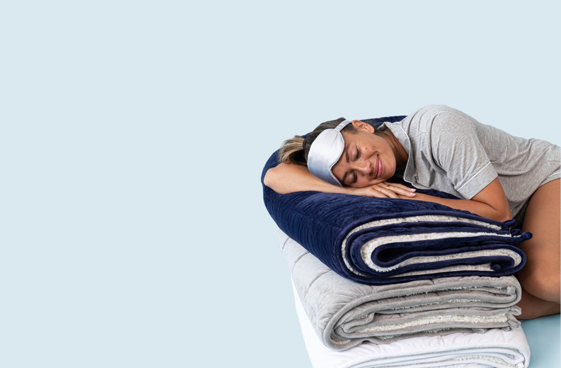 woman laying on weighted blankets