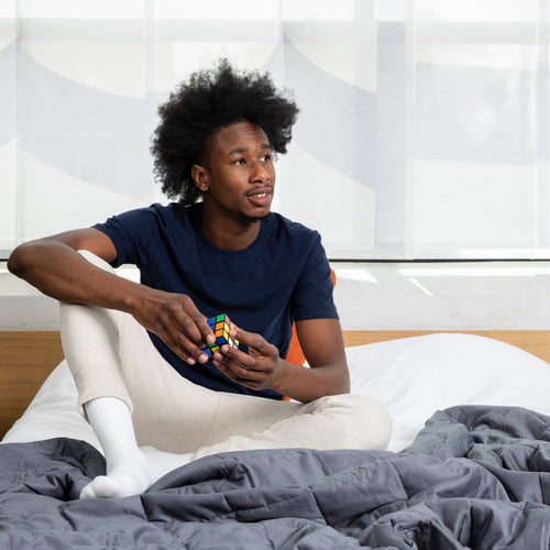 man sitting in bed