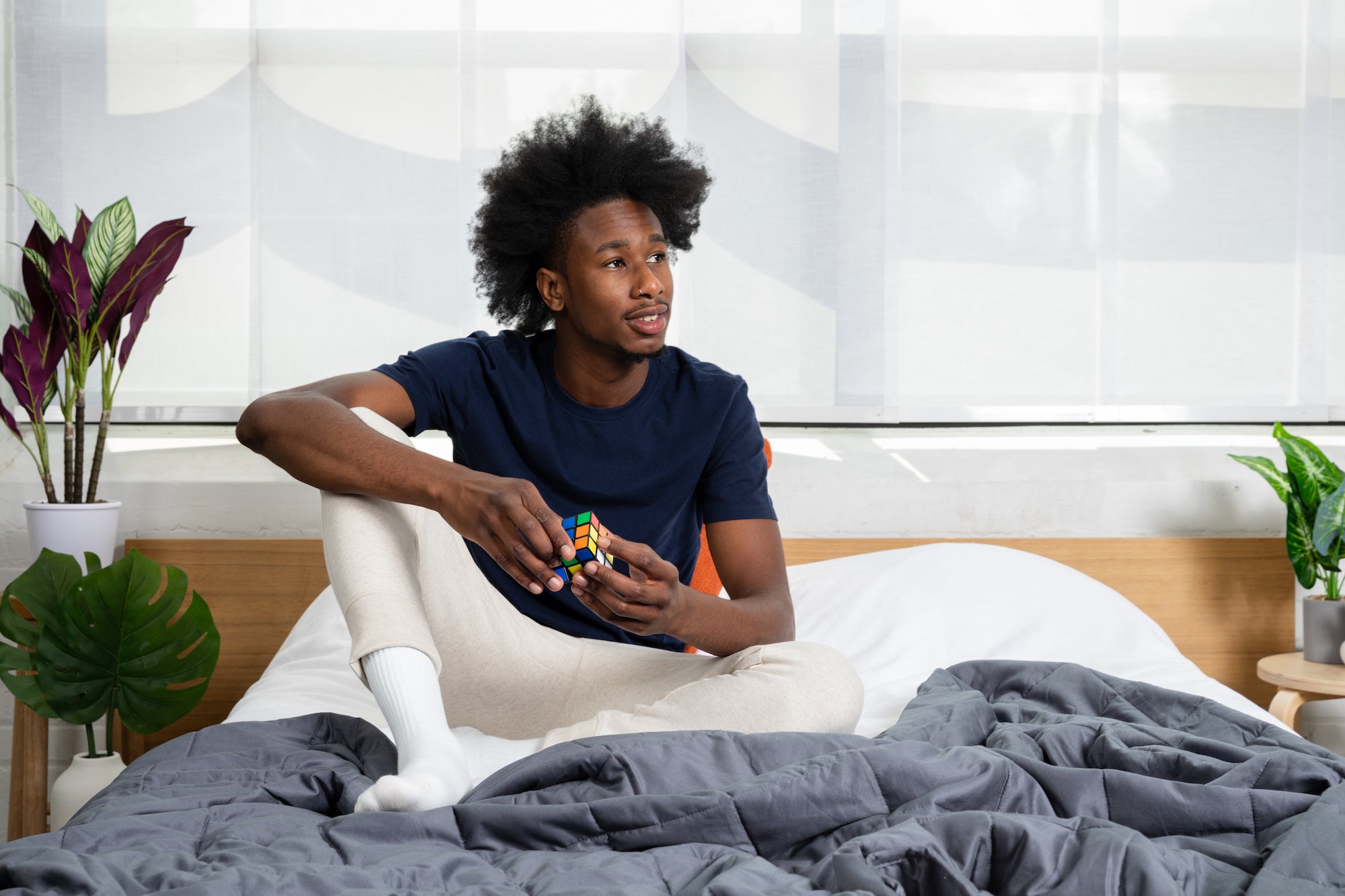 man sitting in bed
