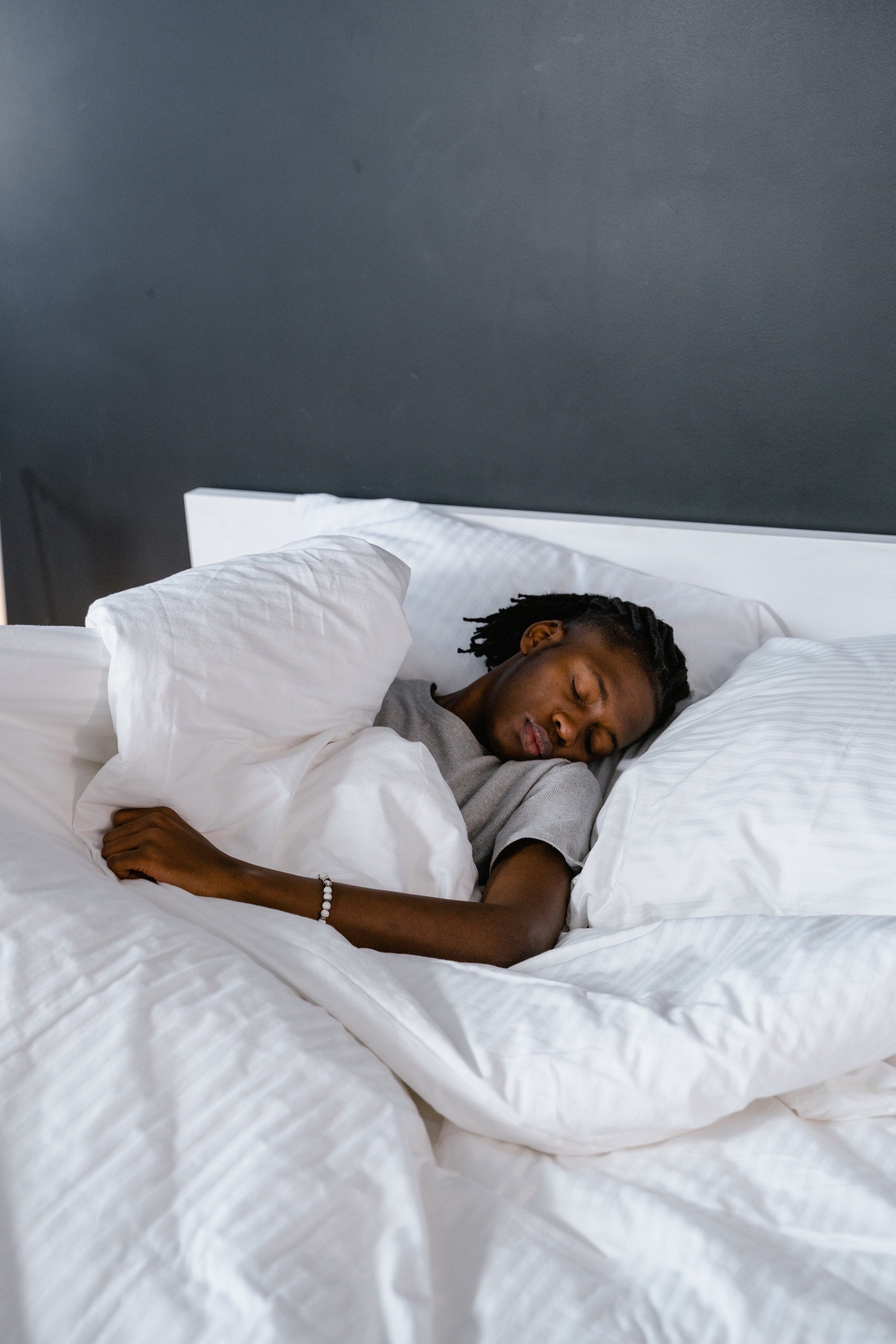 man sleeping in bed