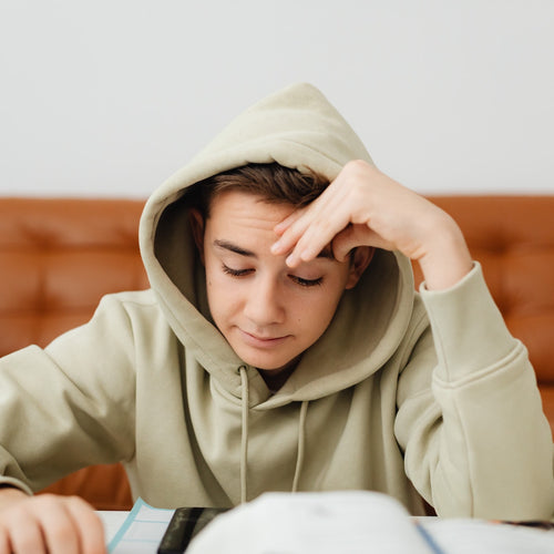 anxious teen looking at homework