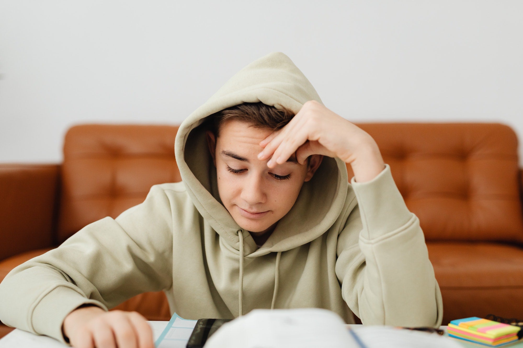 anxious teen looking at homework