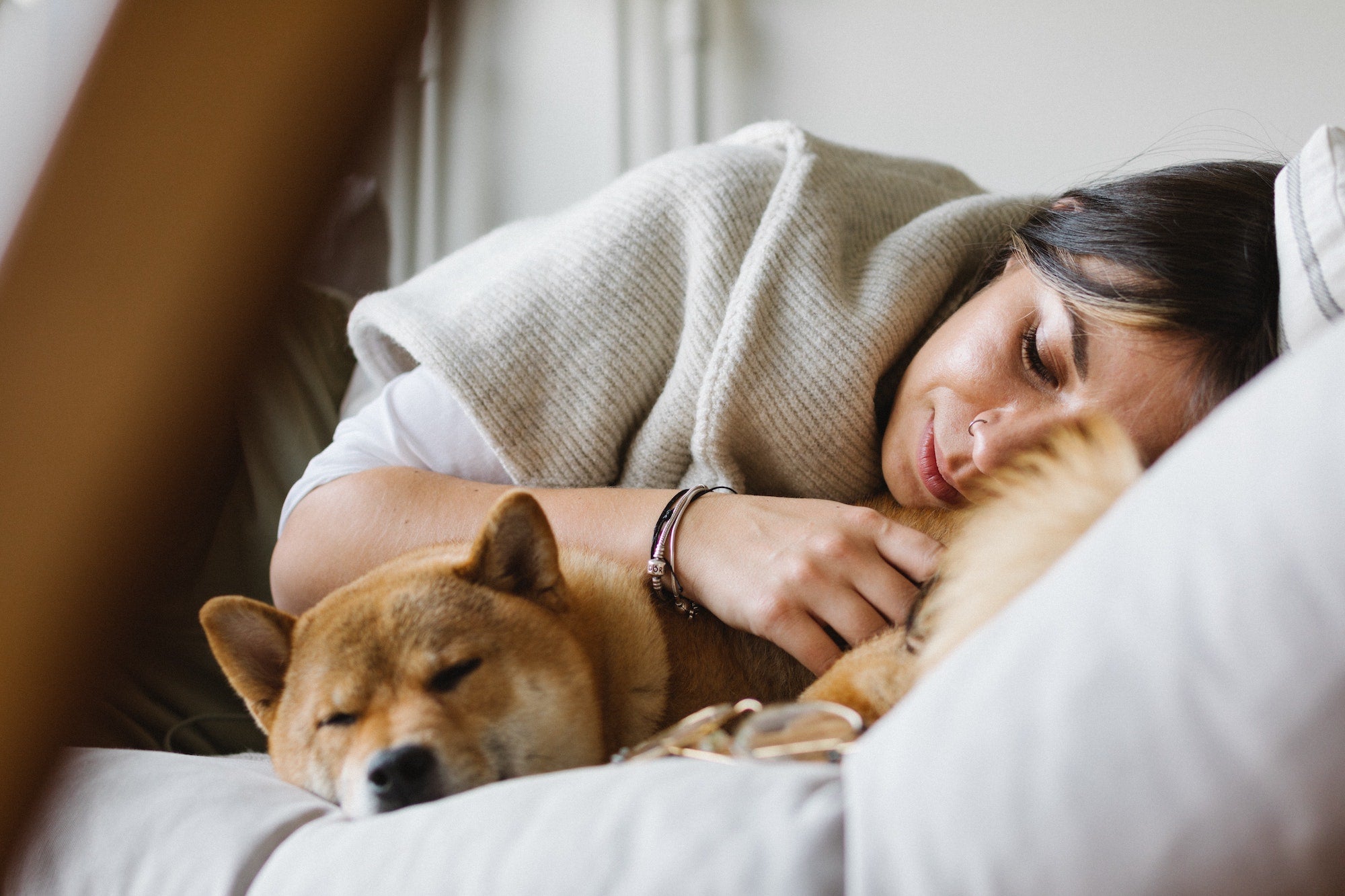 woman and dog sleeping