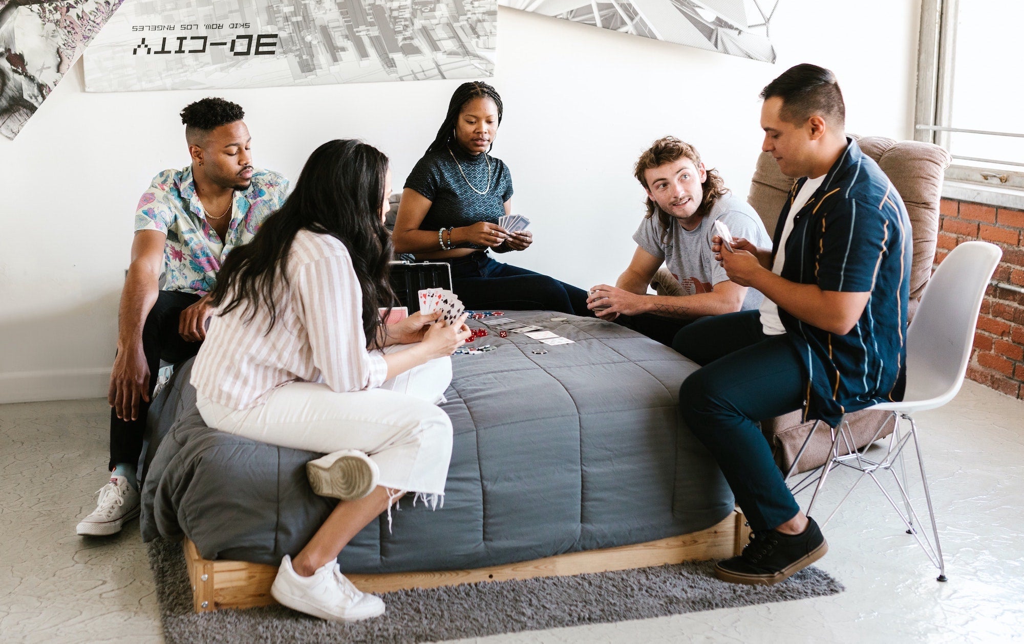 students playing cards in college dorm room